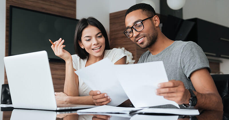 Couple Calculating Future Home Loan Payments