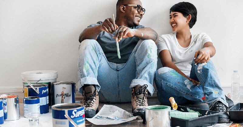 couple painting home improvement