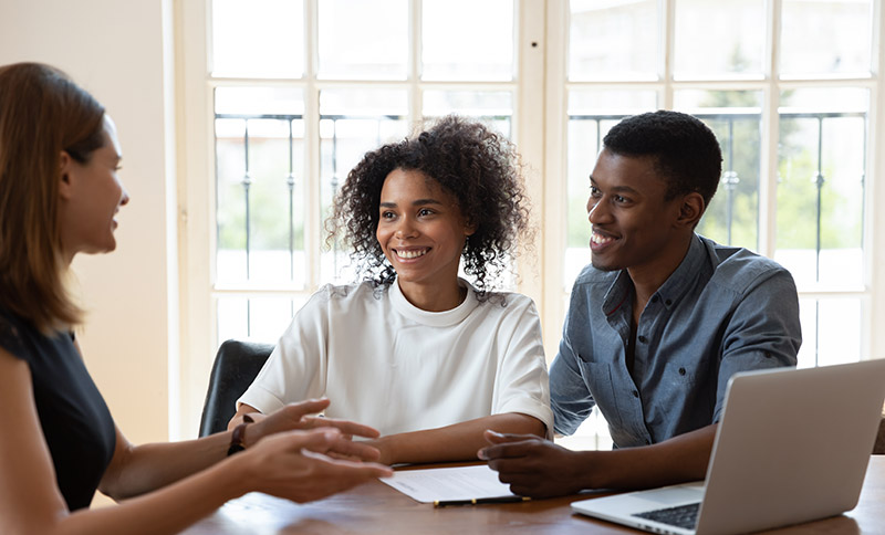 Couple discussing loan options with a mortgage professional