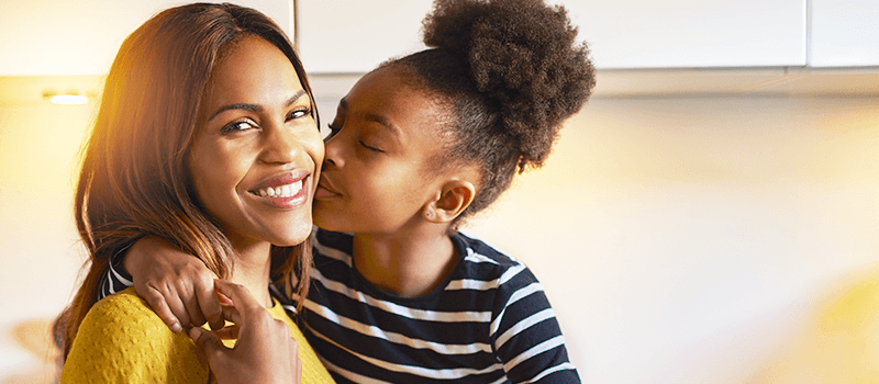 Mother and daughter hugging