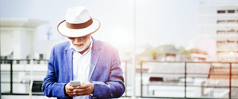 Older man looking at smartphone