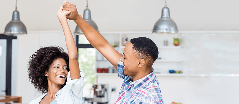 Couple celebrating in new home