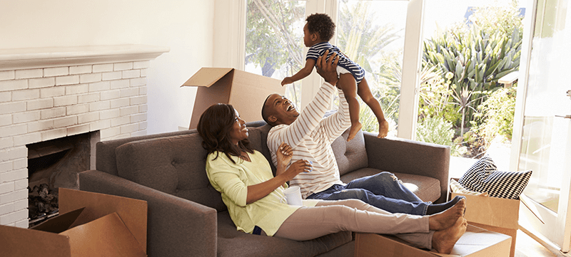 Happy family moving into new home