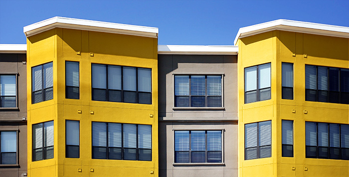 RetailBlog2 gray and yellow condo complex