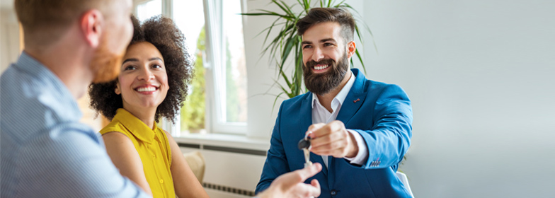 buying-a-fixer-upper-blog-Nov-2020 Couple receiving keys to new home
