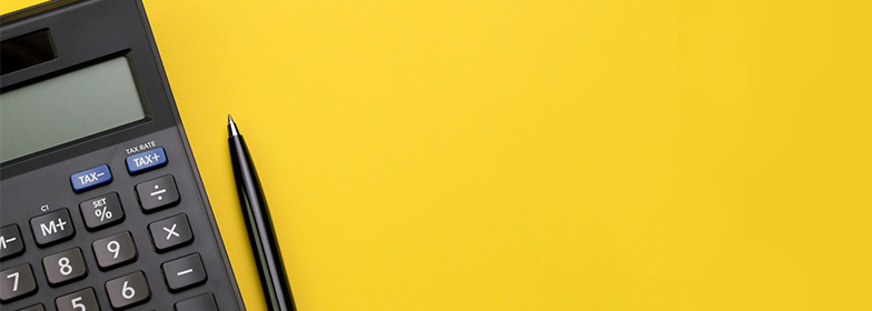 what-are-closing-costs-jan-blog-21 Calculator and pen on yellow background