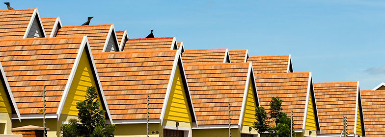 Row of yellow houses on neighborhood street