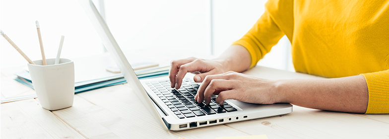 Blog-2 Man at desk typing on laptop