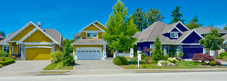 PR-FreddieMac Street view of yellow home in neighborhood