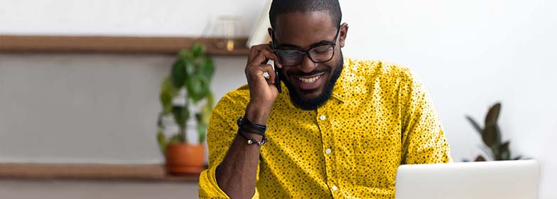 August Blog 4 Man talking on phone at desk