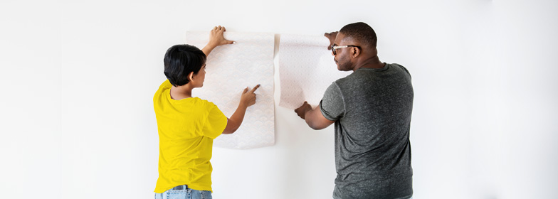 Couple testing out wallpaper in home