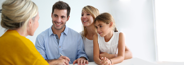 what-does-a-loan-officer-assistant-do Smiling couple with child talking to assistant