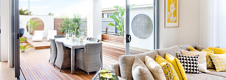 May Blog 4 An image of a family room that looks out to the outdoor dining area.