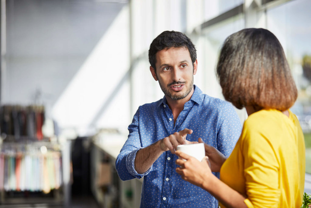 Inman-logo Man and woman having coffee