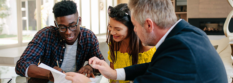 A couple talking to a loan officer