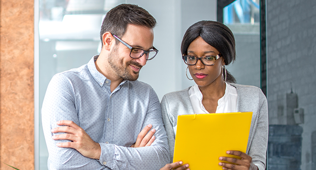 Coworkers reviewing paperwork