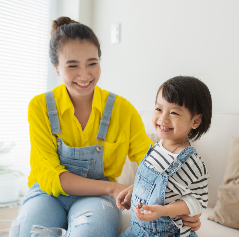 Smiling mother and daughter