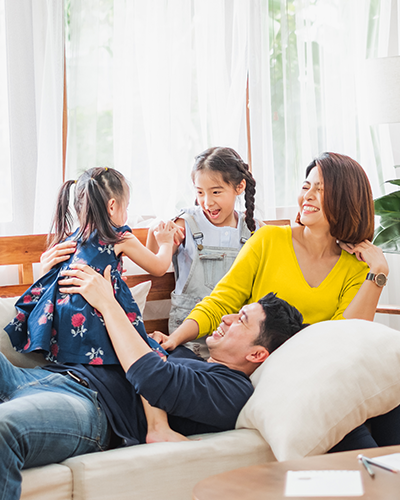 Smiling family on couch