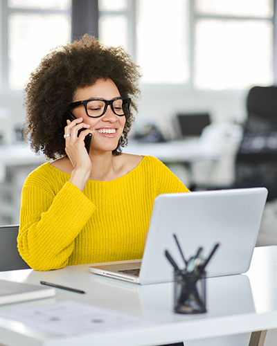 Smiling business woman on the phone