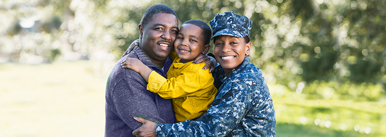 A veteran family smiling