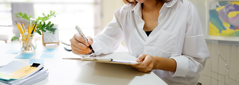 Woman looking at checklist in home