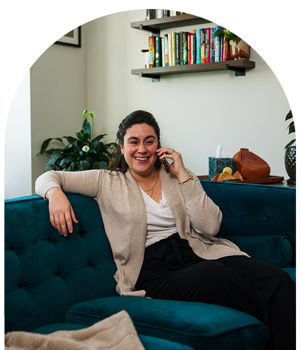 Smiling woman on the phone in living room