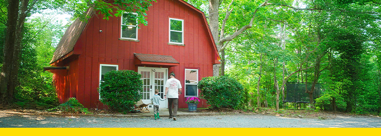 1 USDA Lender_award_Press release header Father and son walking towards barn
