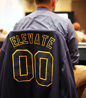 Back of sports jacket with inset words 'Elevate 00'
